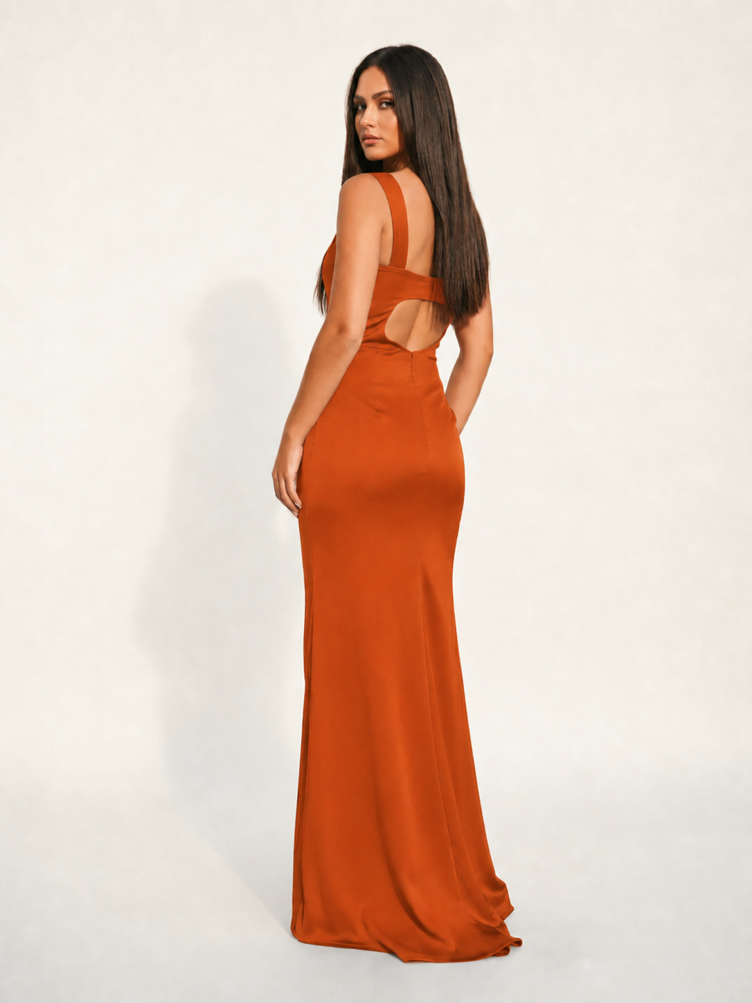 Satin cup-shaped halter dress with back opening revealing the back