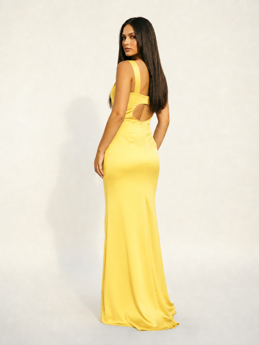 Satin cup-shaped halter dress with back opening revealing the back