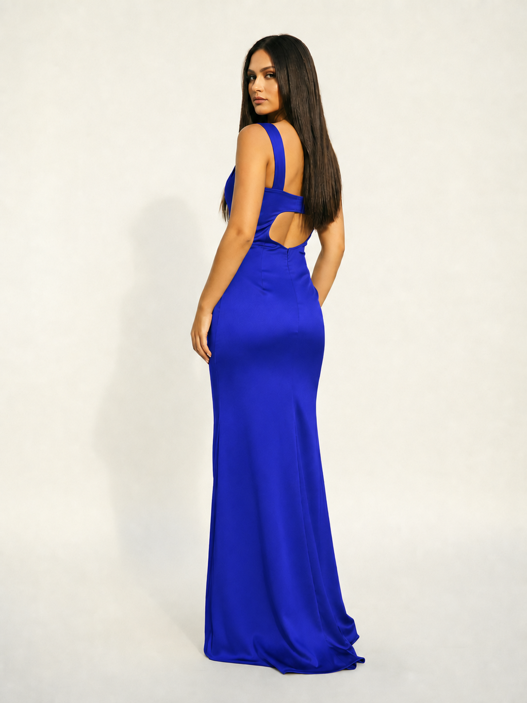 Satin cup-shaped halter dress with back opening revealing the back